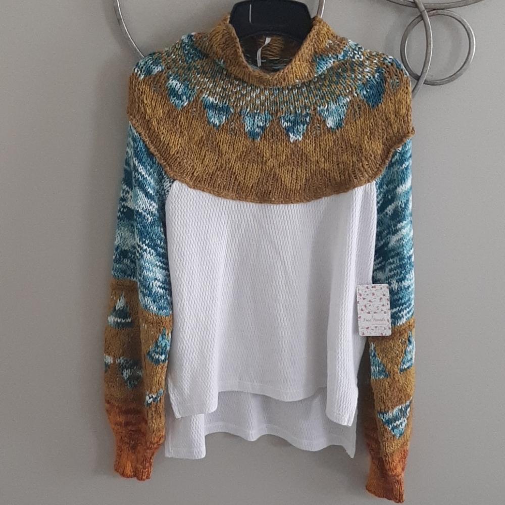 Like new Free People mock neck sweater.  Worn one time.  Tag was removed.